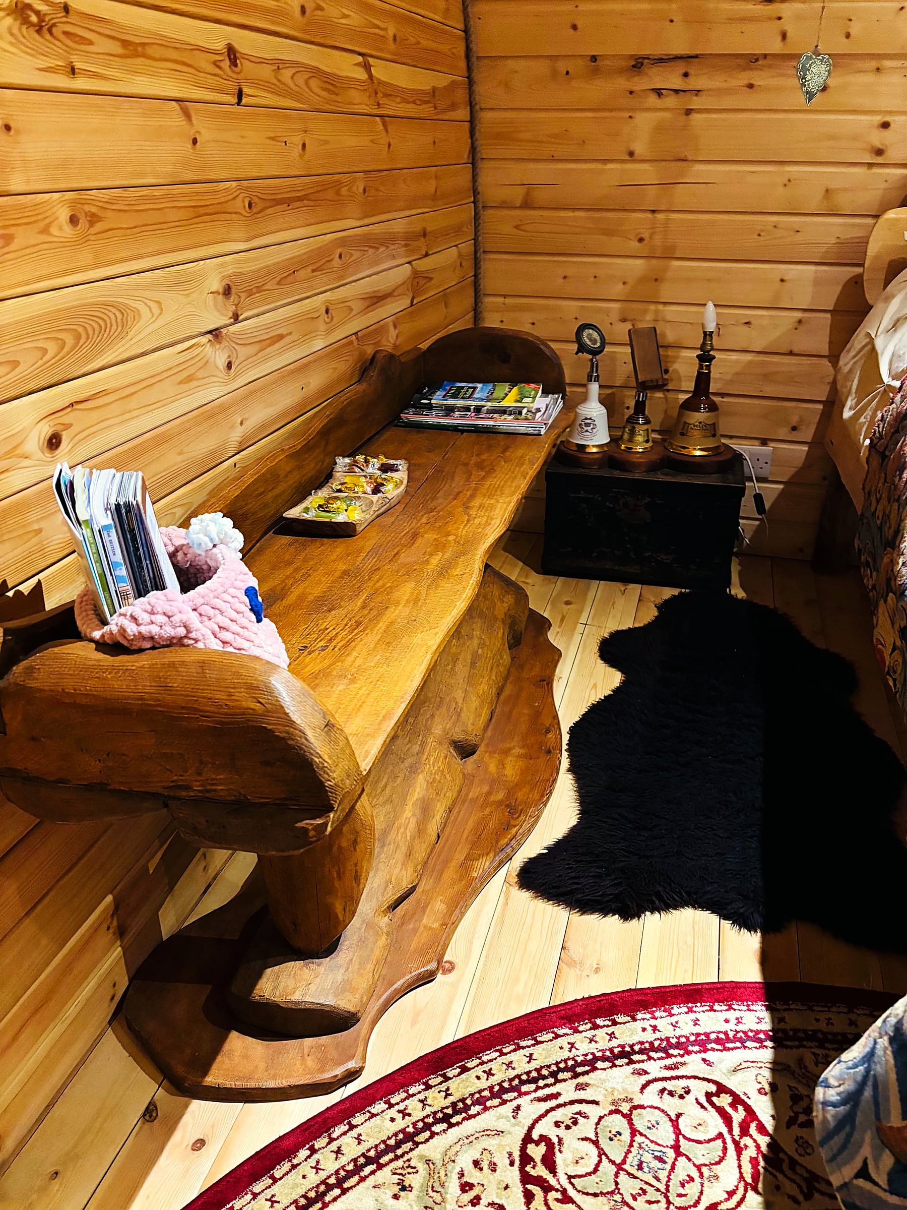 Inside the hobbit house — warm timber living space — view 3
